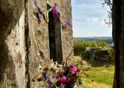 Wild flowers in an empty window before the public arrive